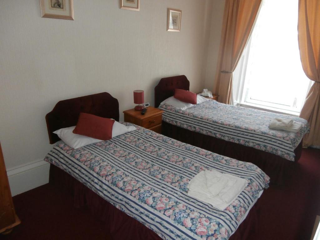 Postel nebo postele na pokoji v ubytování Monorene Guest House