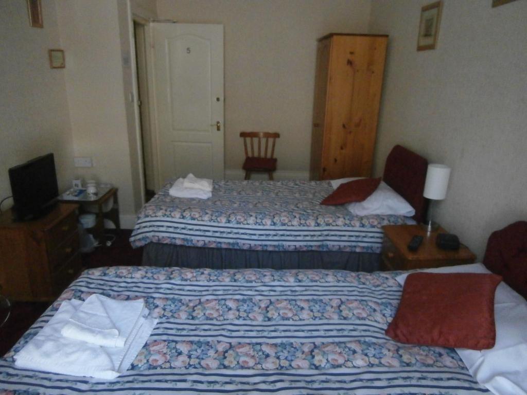 Postel nebo postele na pokoji v ubytování Monorene Guest House