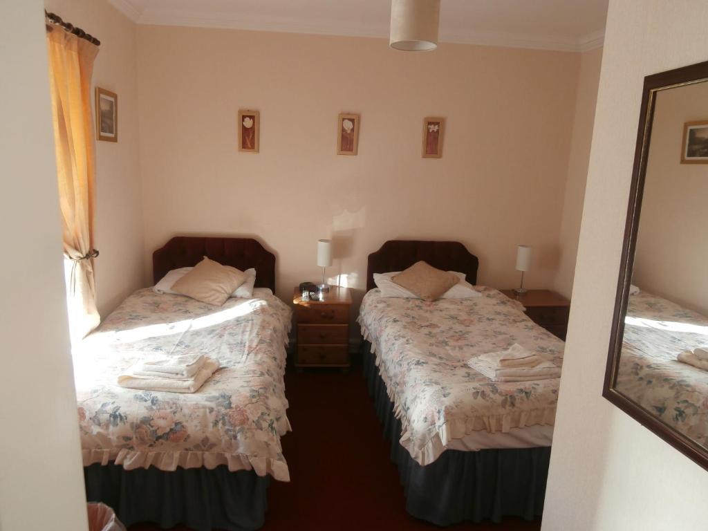 Postel nebo postele na pokoji v ubytování Monorene Guest House