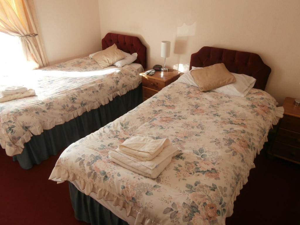 Postel nebo postele na pokoji v ubytování Monorene Guest House