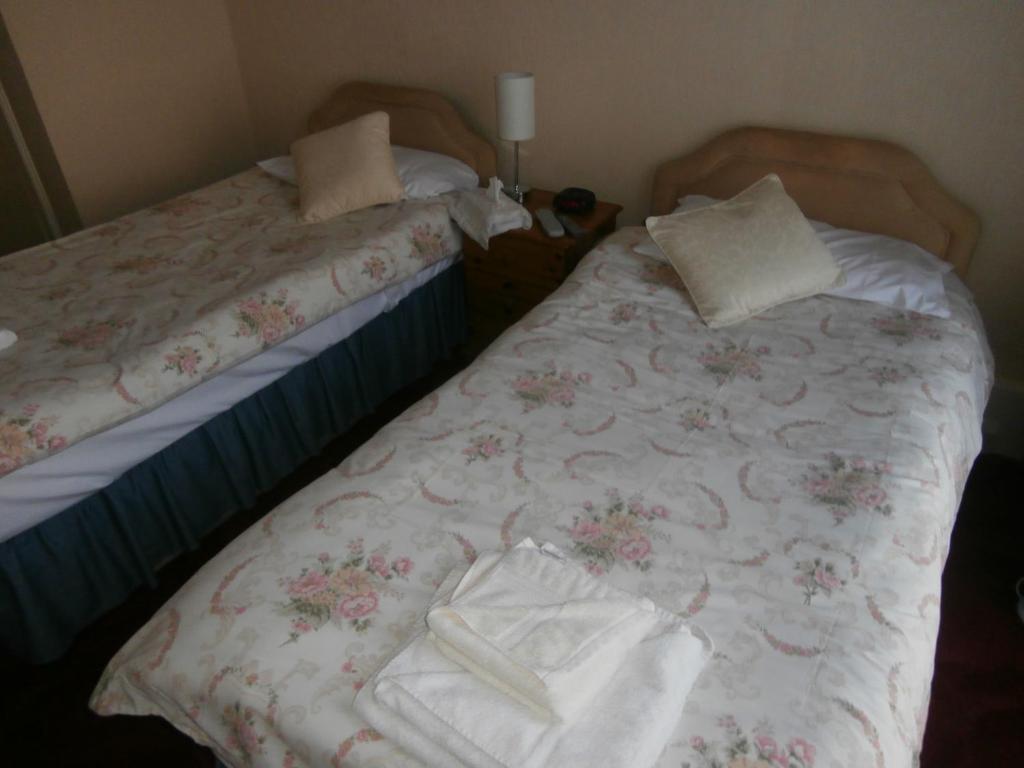 Postel nebo postele na pokoji v ubytování Monorene Guest House