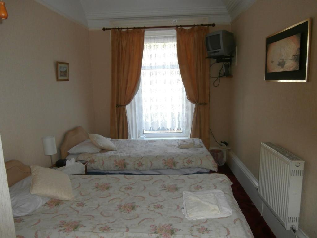 Postel nebo postele na pokoji v ubytování Monorene Guest House