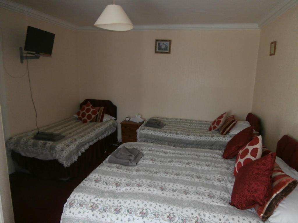 Postel nebo postele na pokoji v ubytování Monorene Guest House