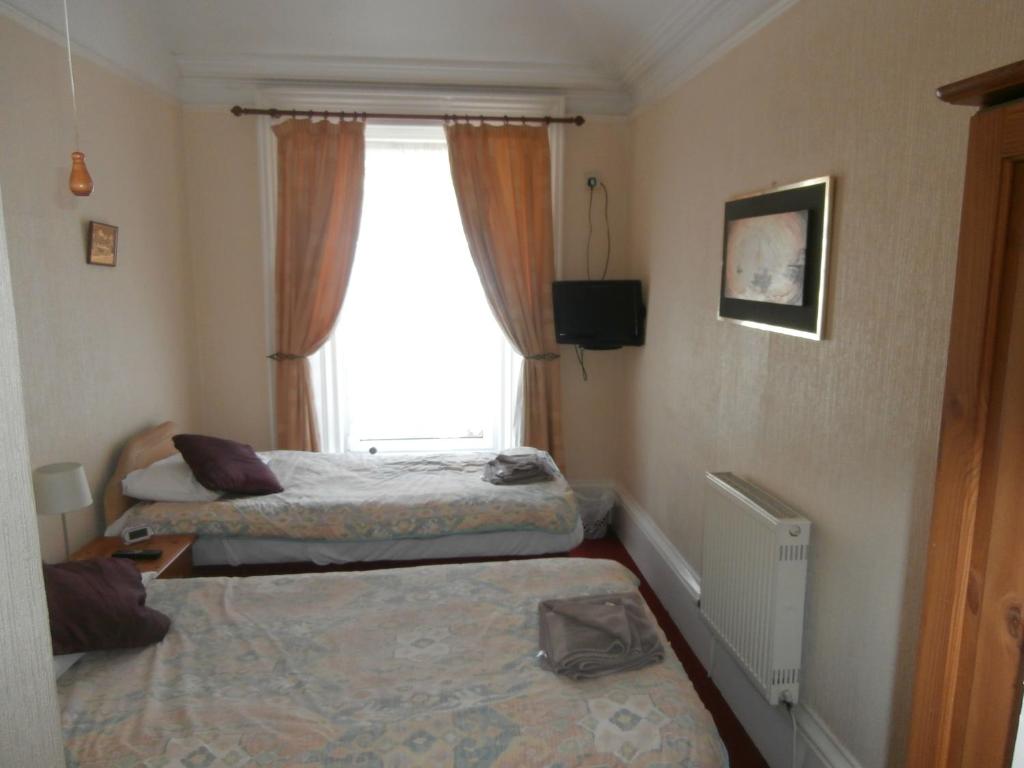 Postel nebo postele na pokoji v ubytování Monorene Guest House