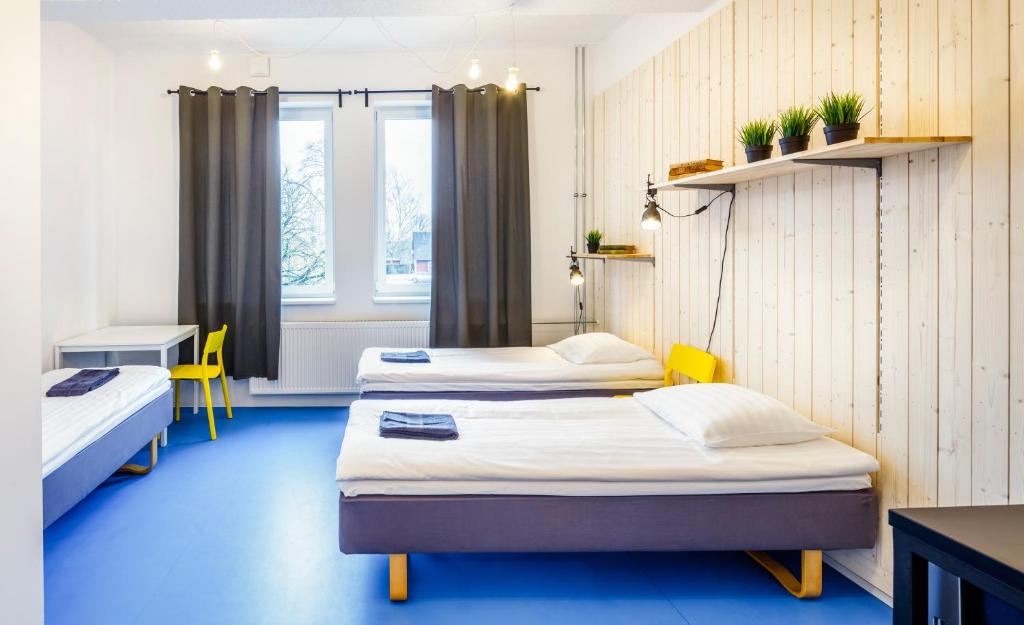 Voodi või voodid majutusasutuse Hektor Design Hostel toas