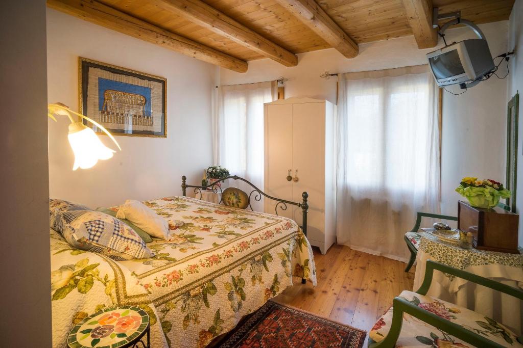 Postel nebo postele na pokoji v ubytování Casa Fiorina