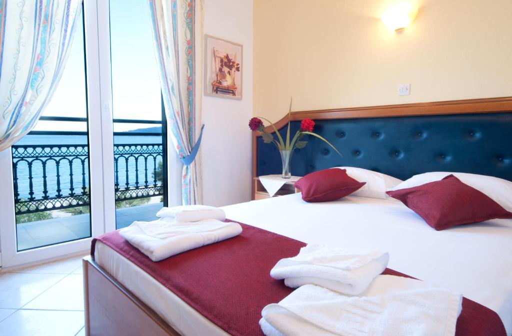 Postel nebo postele na pokoji v ubytování Fedra Hotel