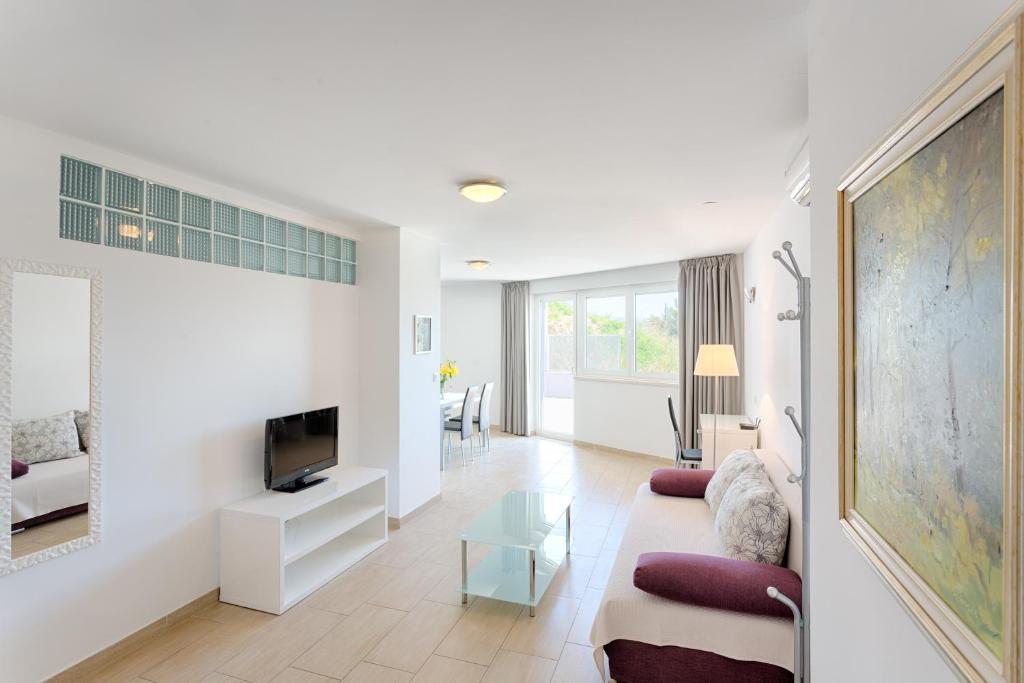 TV a/nebo společenská místnost v ubytování Adriatic Queen Rooms & Apartments