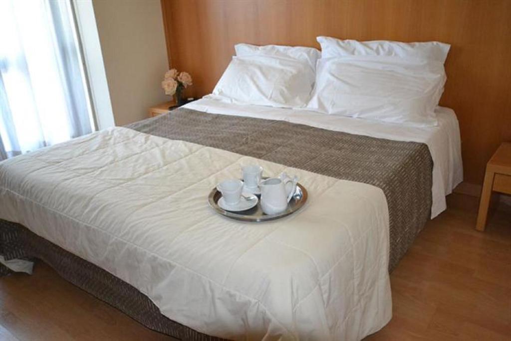 Postel nebo postele na pokoji v ubytování Hotel Ristorante Trendy
