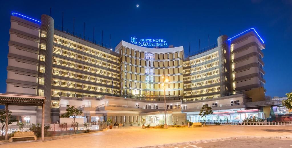 a large building with lights on in a city at HL Suitehotel Playa del Inglés - Adults Only in Playa del Ingles