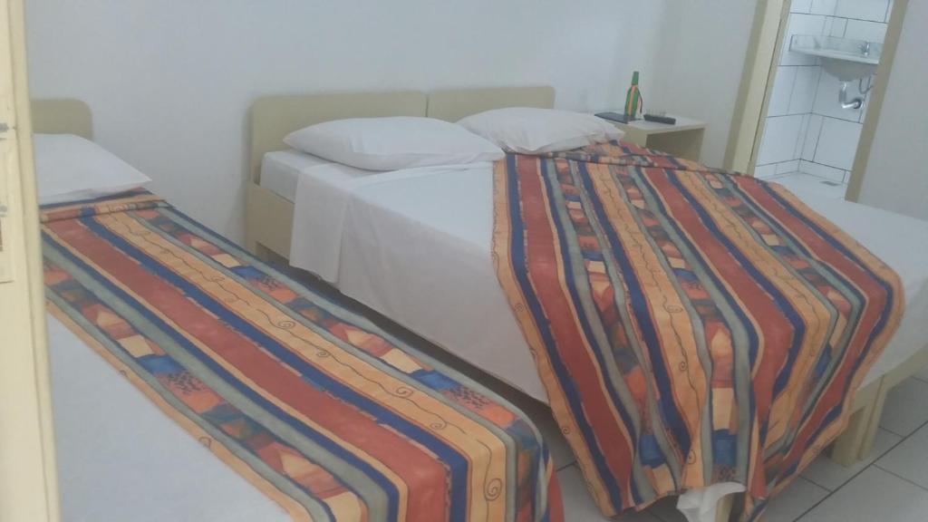 Postel nebo postele na pokoji v ubytování Hotel Pousada Terras do Sem Fim