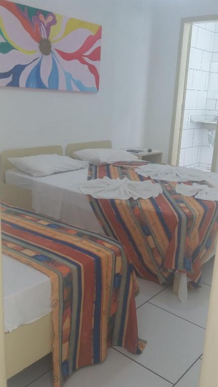 Postel nebo postele na pokoji v ubytování Hotel Pousada Terras do Sem Fim