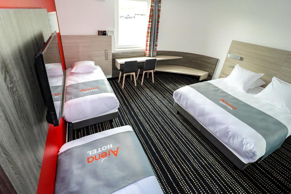 Postel nebo postele na pokoji v ubytování Hotel Arena Toulouse