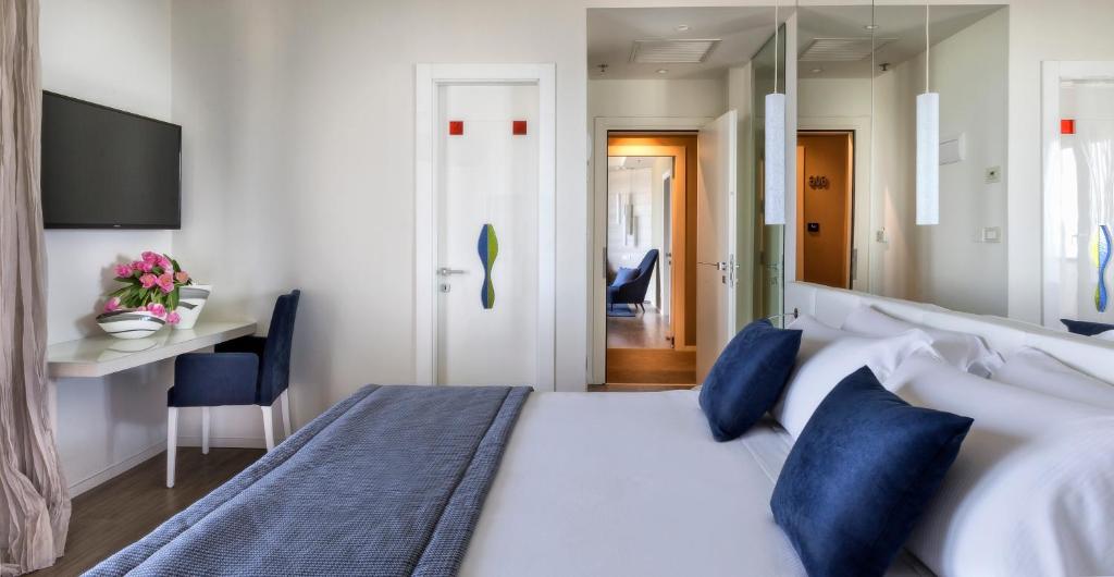 Postel nebo postele na pokoji v ubytování Hotel Nautico