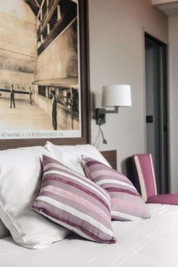 Postel nebo postele na pokoji v ubytování Hotel-Café du Trinquet