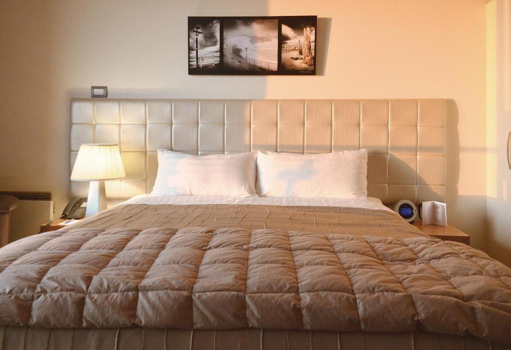 Postel nebo postele na pokoji v ubytování Hotel St Clair
