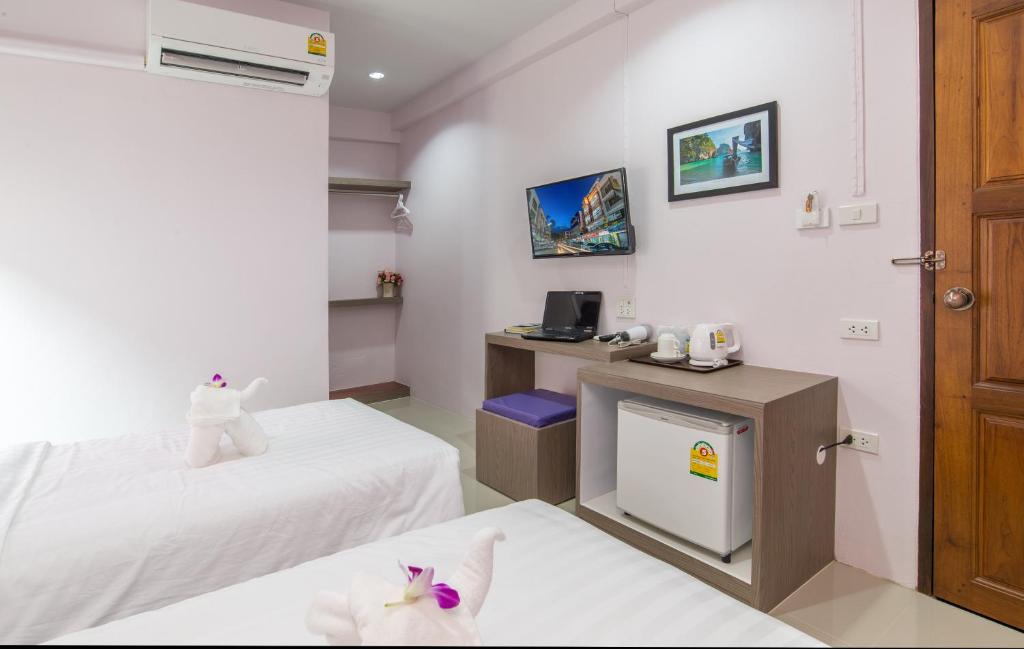 Postel nebo postele na pokoji v ubytování Lada Krabi Express