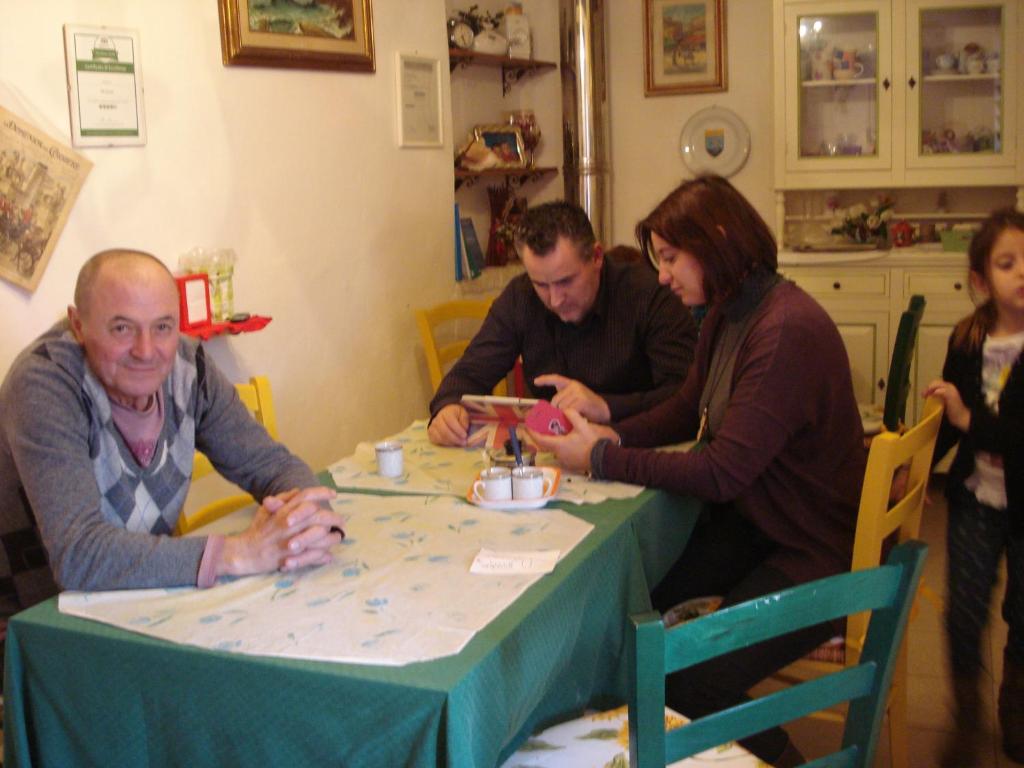 a group of people sitting around a table at Da Giusè in Trebiano