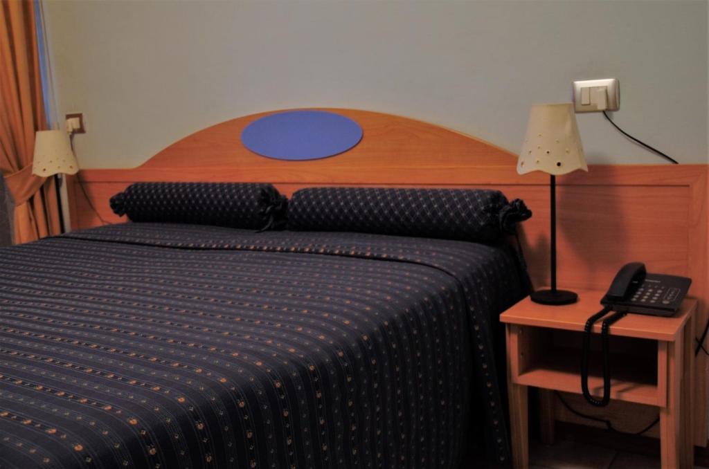 Postel nebo postele na pokoji v ubytování Hotel Morgana