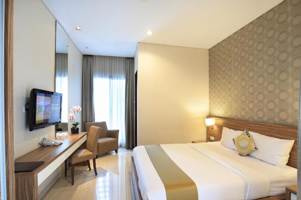 TV a/nebo společenská místnost v ubytování Rasuna Icon Hotel