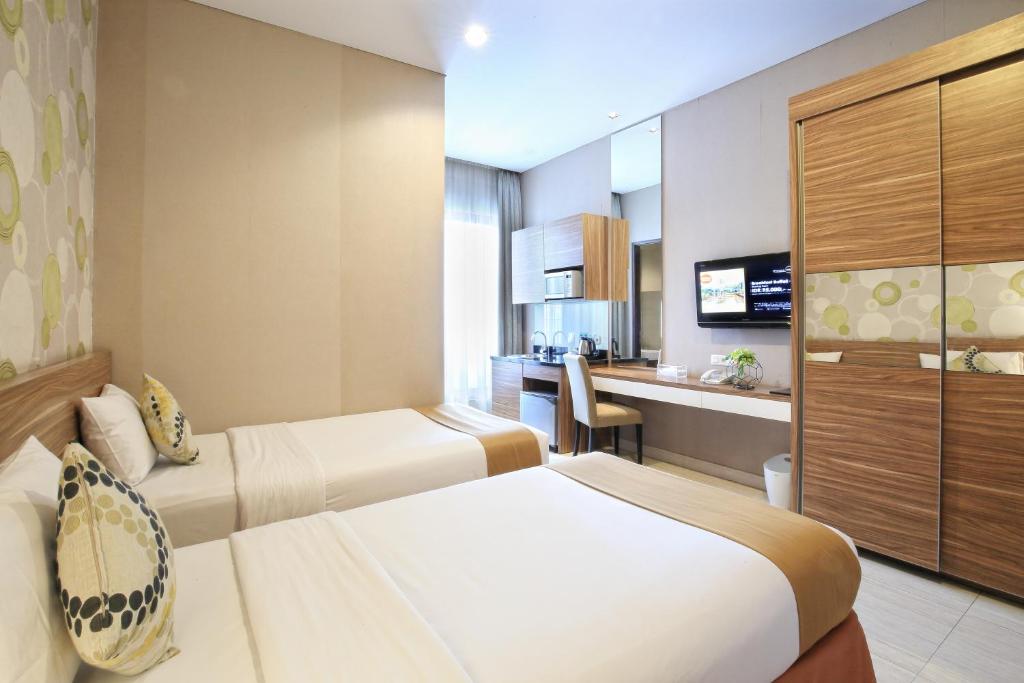 TV a/nebo společenská místnost v ubytování Rasuna Icon Hotel
