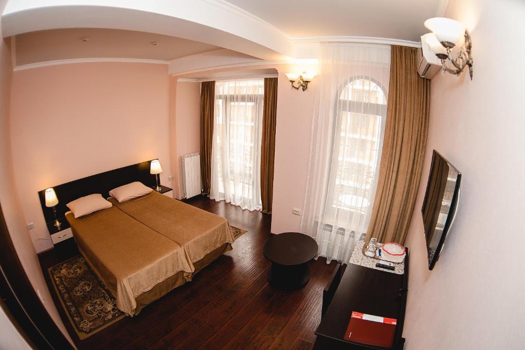  Кровать или кровати в номере Гостевой дом БоНаМи 