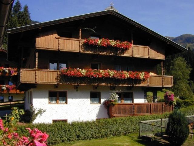 a large building with flower boxes on it at Haus Fichtenblick in Auffach