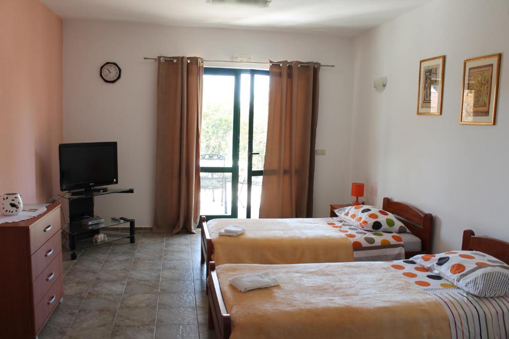 Posteľ alebo postele v izbe v ubytovaní Blanka Apartment