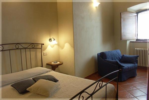 Posteľ alebo postele v izbe v ubytovaní Casa Vacanze Vertine
