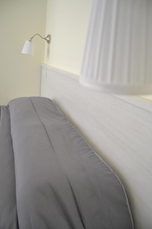 Postel nebo postele na pokoji v ubytování Guesthouse Holiday Formia beach