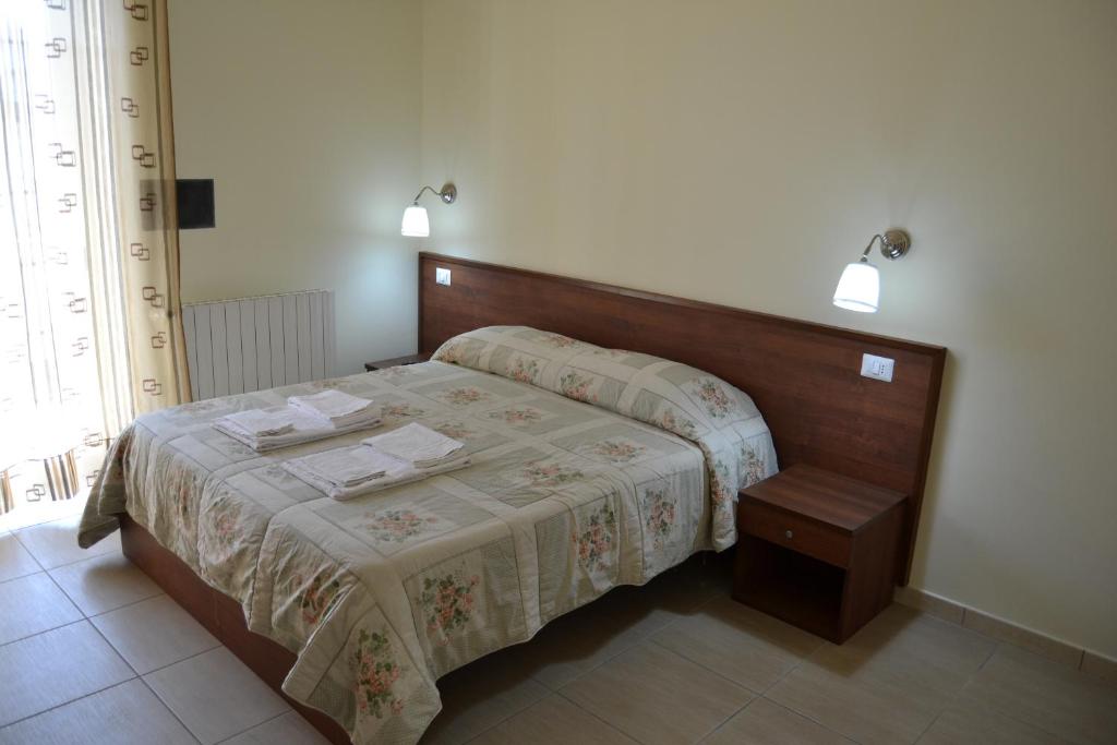 Postel nebo postele na pokoji v ubytování Guesthouse Holiday Formia beach