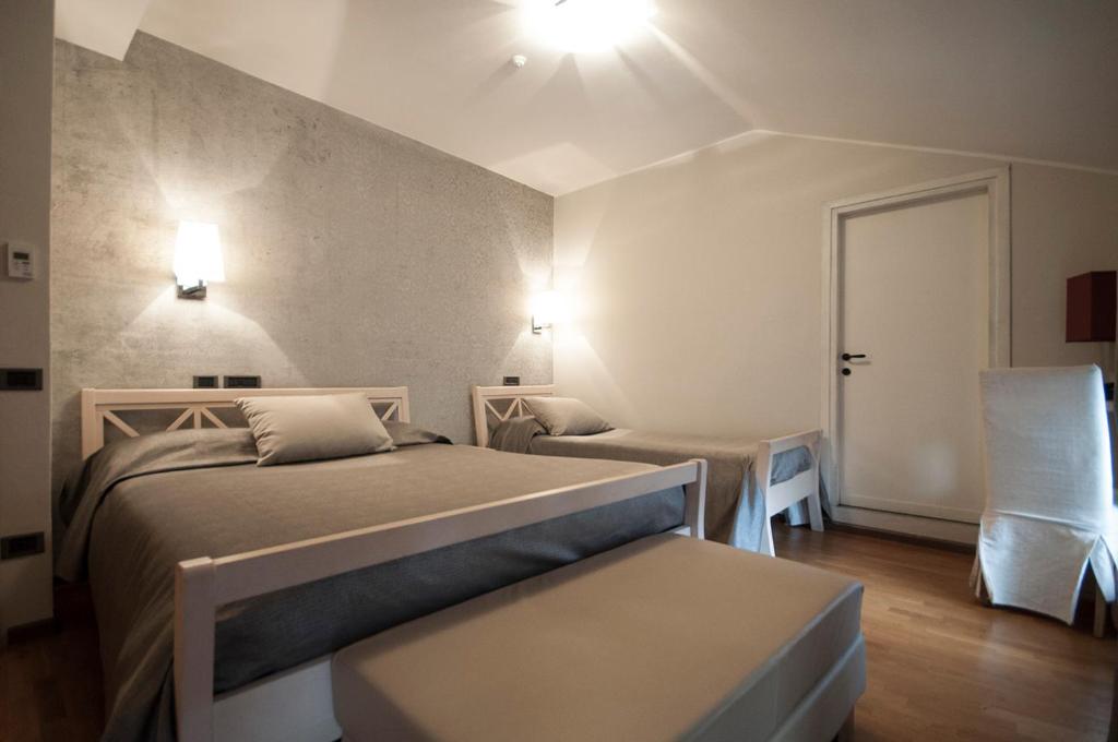 Postel nebo postele na pokoji v ubytování Hotel Maloia