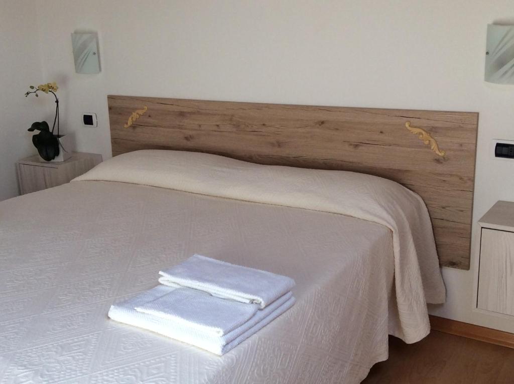 Postel nebo postele na pokoji v ubytování Appartamento A Due Passi