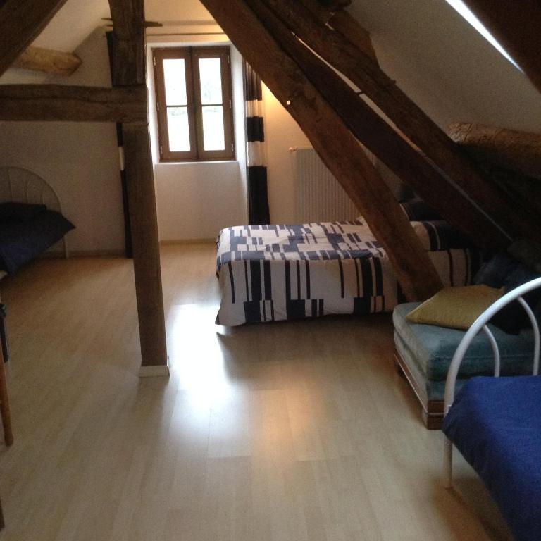 Postel nebo postele na pokoji v ubytování Entre Bourgogne et Morvan