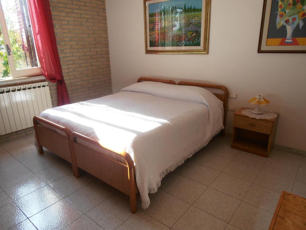 Postel nebo postele na pokoji v ubytování B&B Colle Acquabella