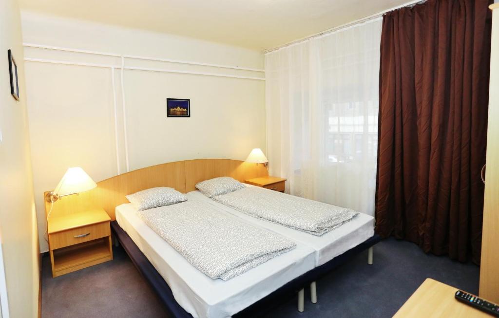Postel nebo postele na pokoji v ubytování Mezzo Budapest