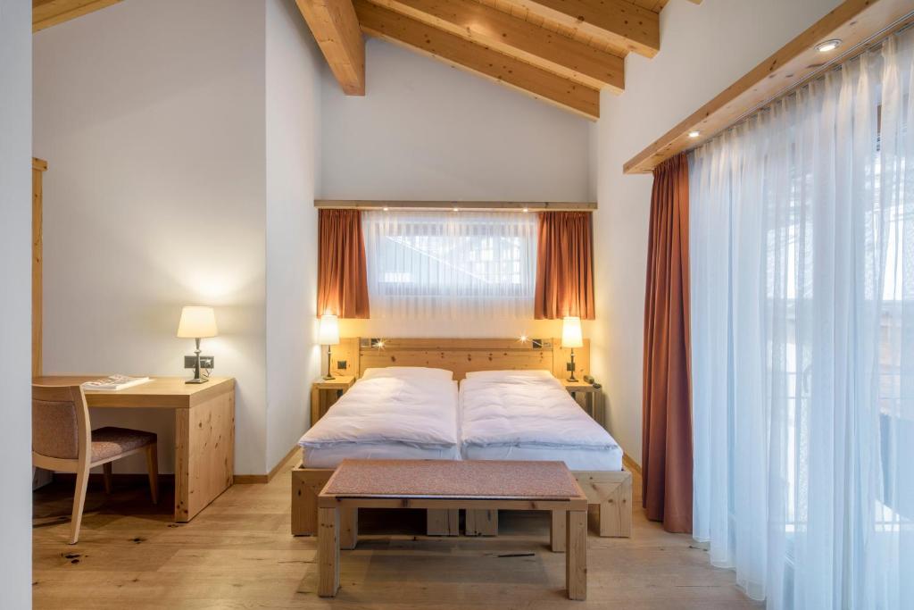 Postel nebo postele na pokoji v ubytování Hotel Phoenix