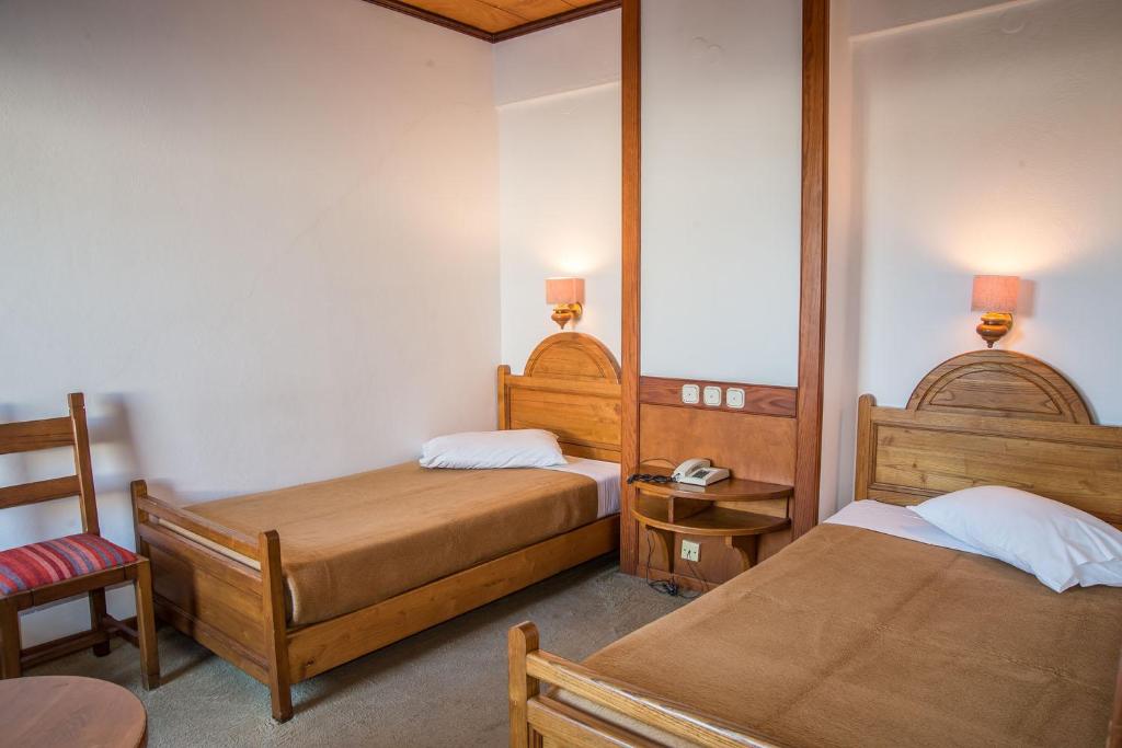 Postel nebo postele na pokoji v ubytování Hotel Galini Patmos