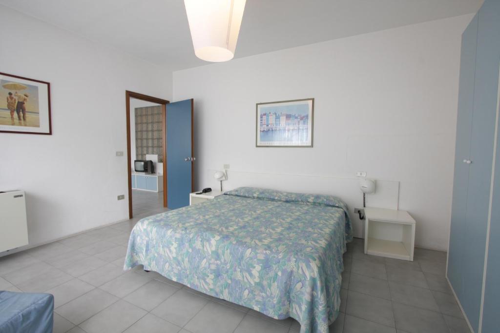 Postel nebo postele na pokoji v ubytování Grand Hotel Golf