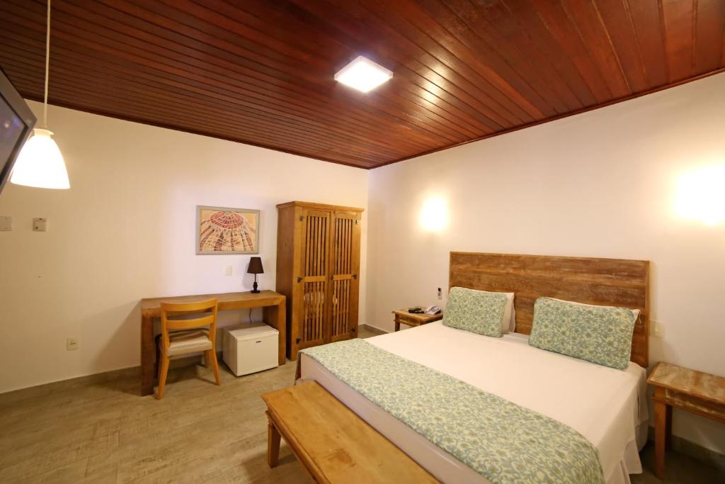 En eller flere senge i et værelse på Coconut's Maresias Hotel