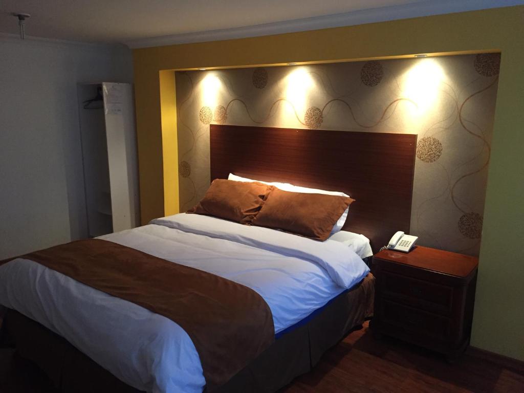 Postel nebo postele na pokoji v ubytování Gran Hotel Napoleón