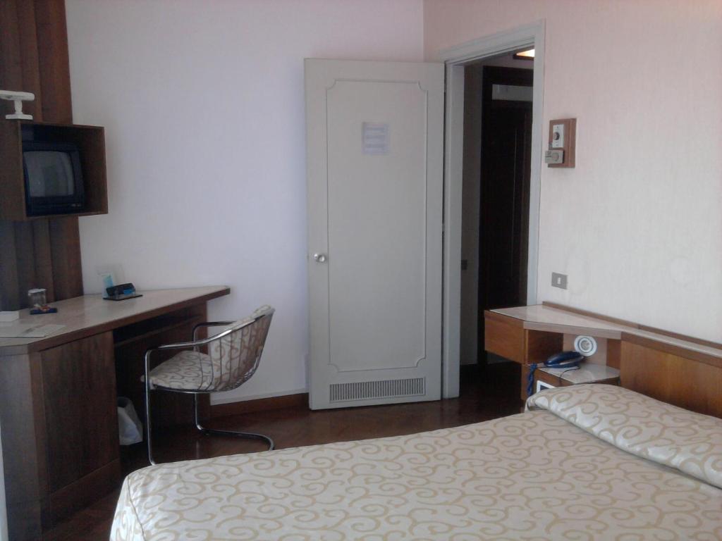 Postel nebo postele na pokoji v ubytování Grand Hotel Golf