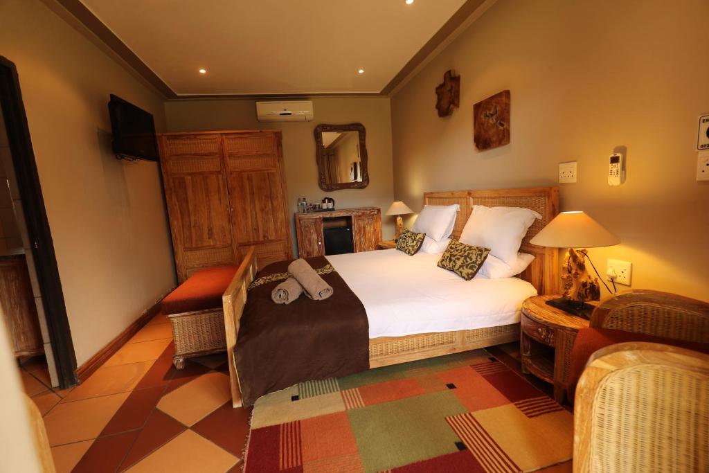 Postel nebo postele na pokoji v ubytování N'taba River Lodge & Spa