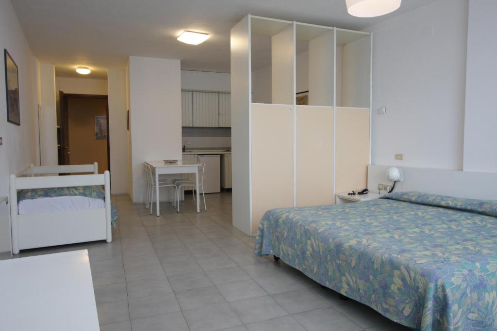 Postel nebo postele na pokoji v ubytování Grand Hotel Golf
