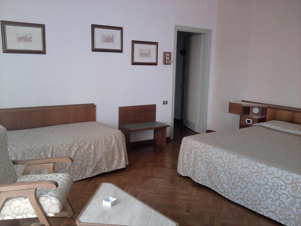 Postel nebo postele na pokoji v ubytování Grand Hotel Golf