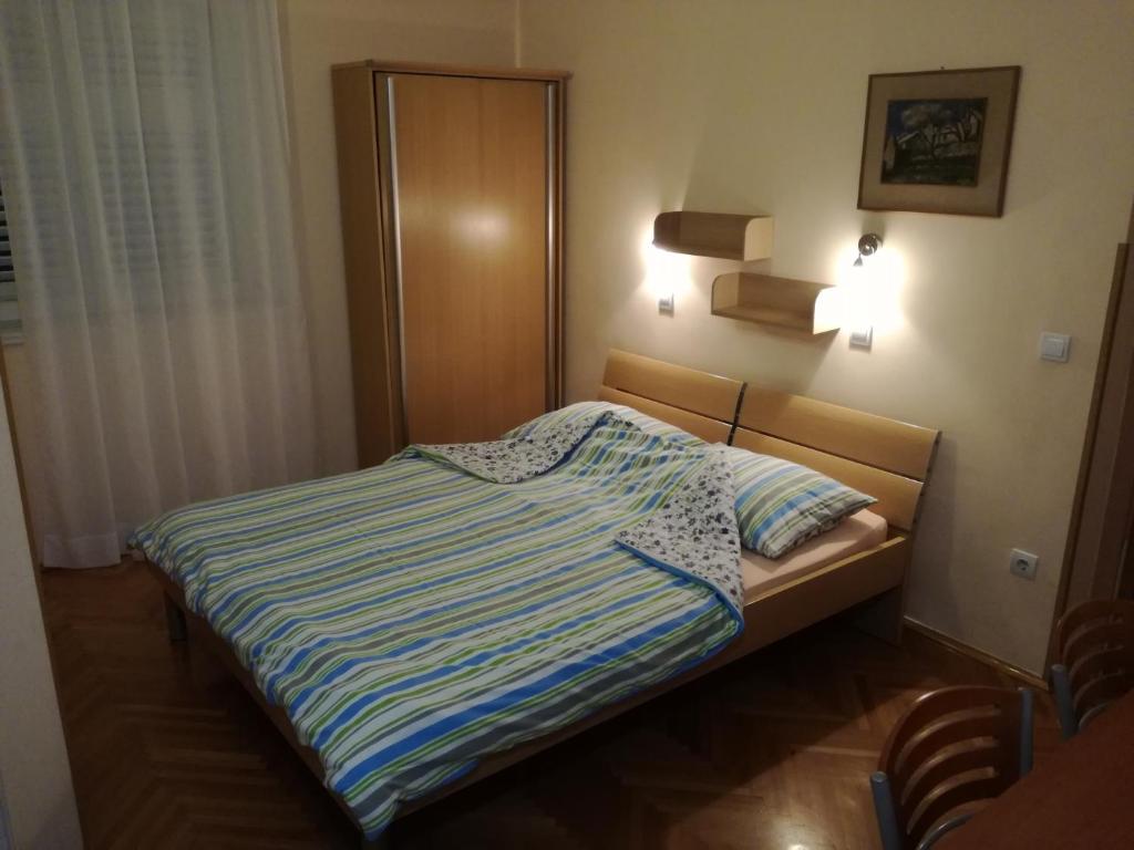 Posteľ alebo postele v izbe v ubytovaní Apartments Kurtic