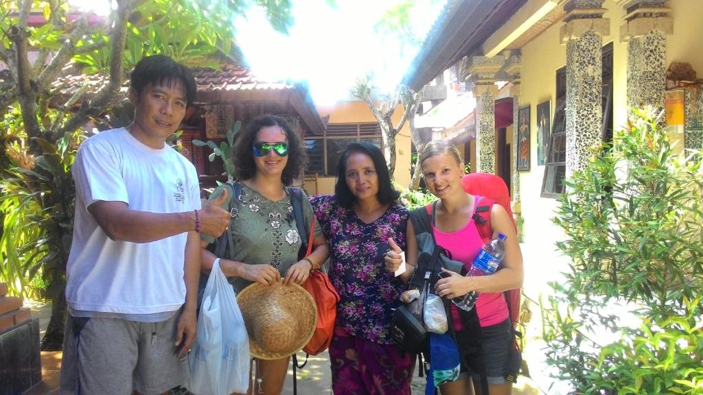 a group of people standing in front of a house at Liang House and Hostel in Ubud