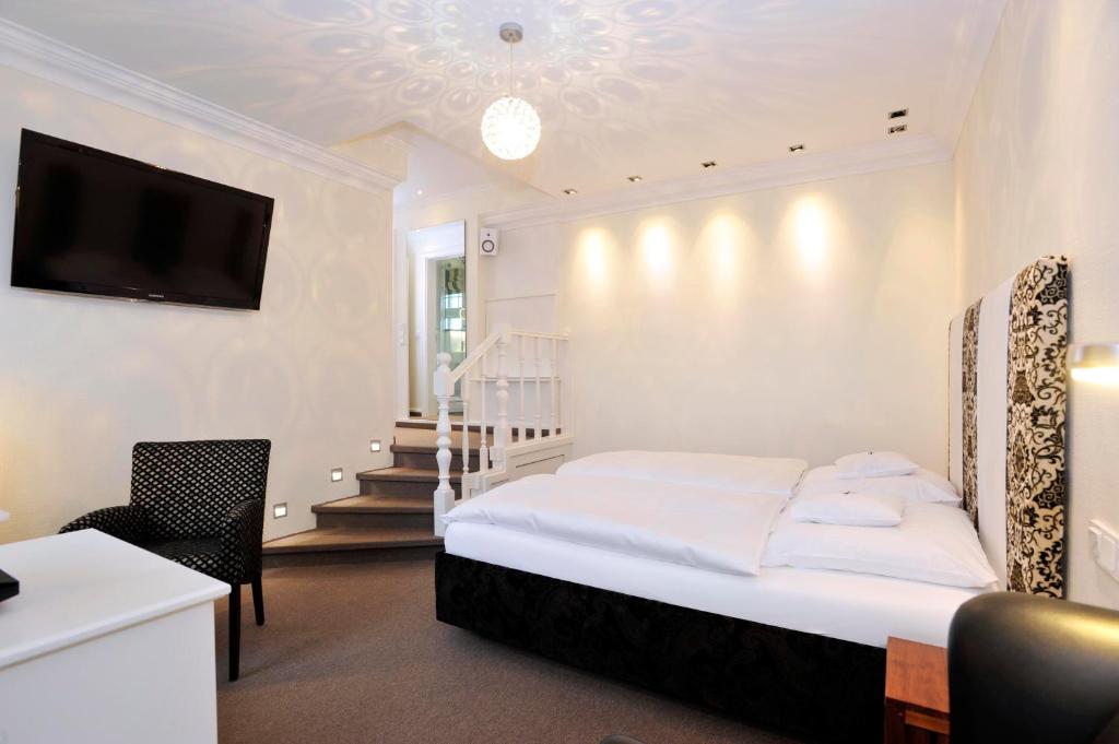 Postel nebo postele na pokoji v ubytování Hotel Strandhörn