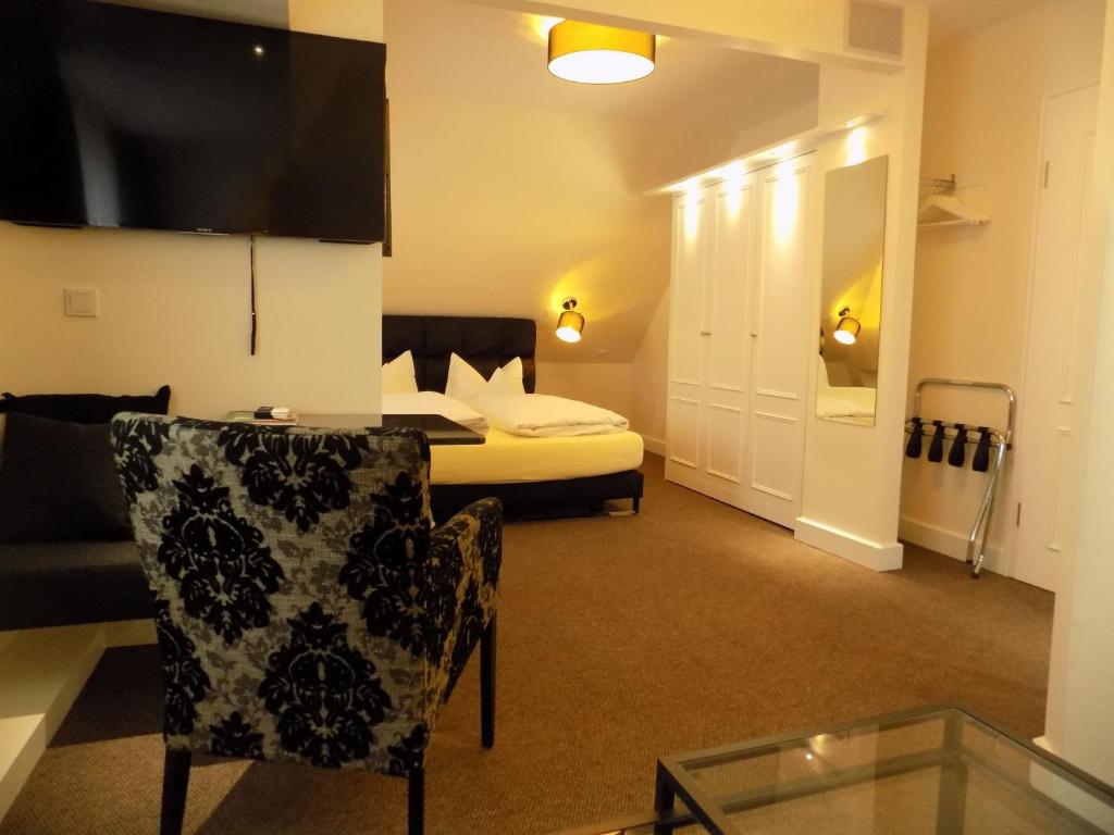 TV a/nebo společenská místnost v ubytování Hotel Strandhörn