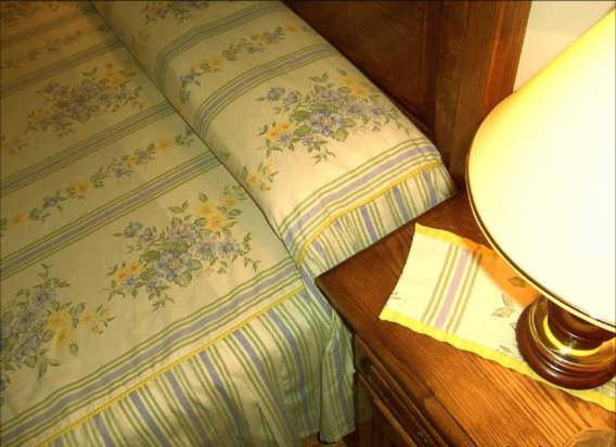 Postel nebo postele na pokoji v ubytování Hostal Las Coronas